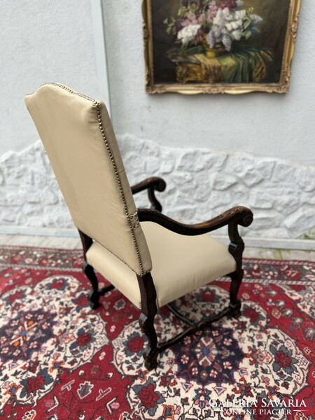 Antique renaissance style carved throne chair with new leather upholstery