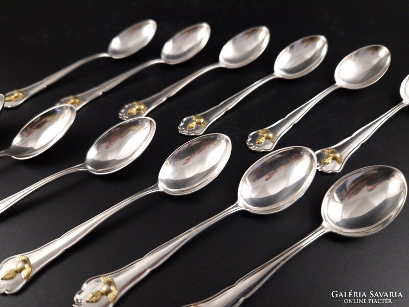 Set of 12 personal silver coffee spoons with gold decoration