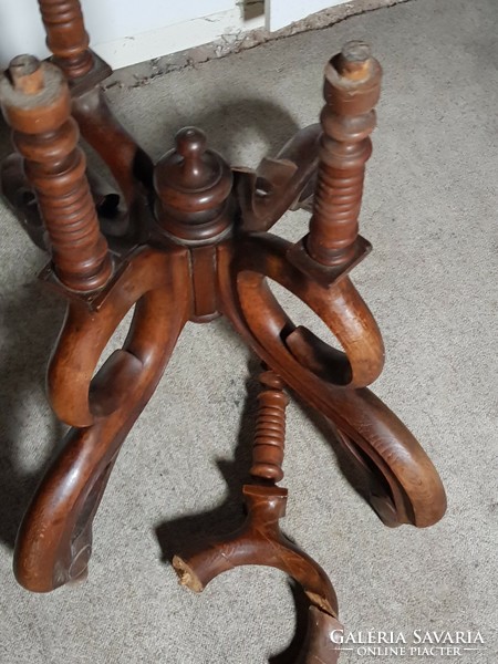 The lower part of an antique table with spider legs (incomplete)