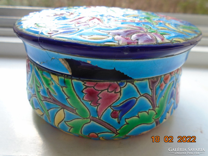 Antique longwy majolica bonbonier embossed with colorful enamel patterns on a turquoise background