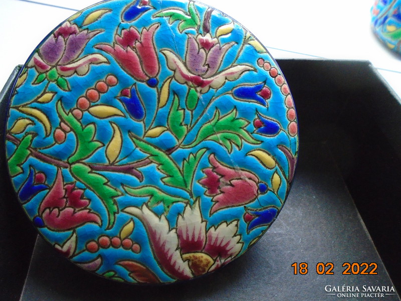 Antique longwy majolica bonbonier embossed with colorful enamel patterns on a turquoise background