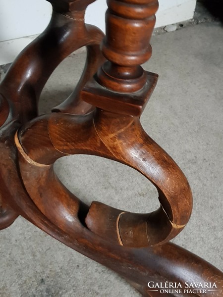 The lower part of an antique table with spider legs (incomplete)