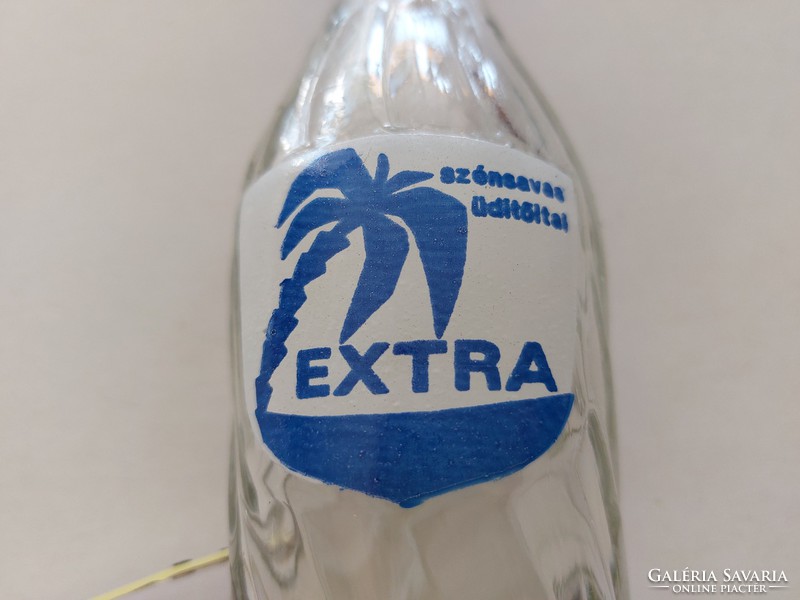 Retro glass bottle of extra carbonated soft drink with inscription