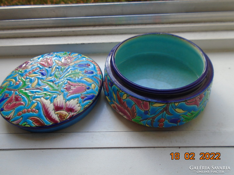 Antique longwy majolica bonbonier embossed with colorful enamel patterns on a turquoise background