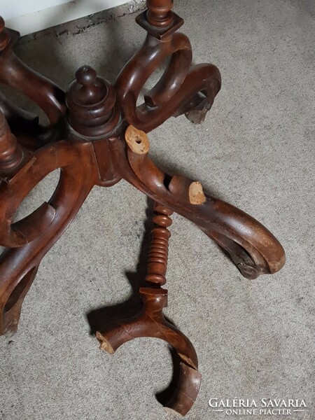 The lower part of an antique table with spider legs (incomplete)