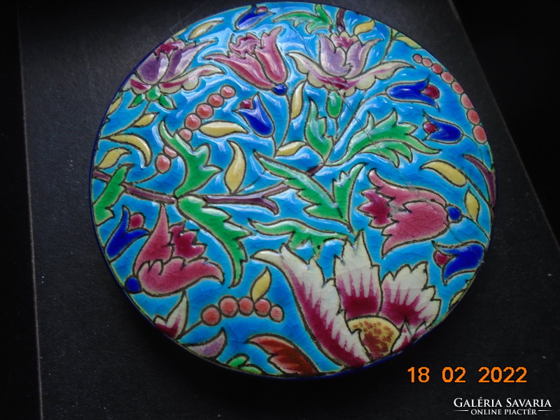 Antique longwy majolica bonbonier embossed with colorful enamel patterns on a turquoise background