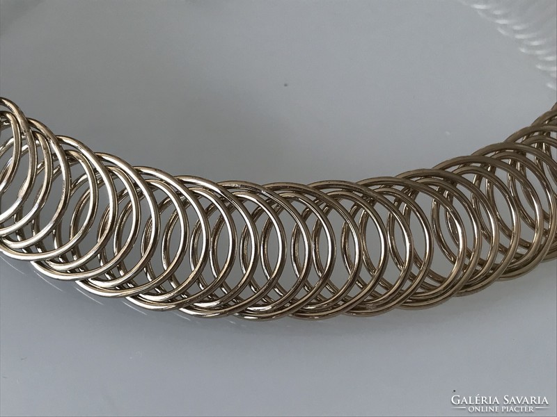 Modern nyakék tekercsszerű dizájn tompa arany színben, 40+8 cm