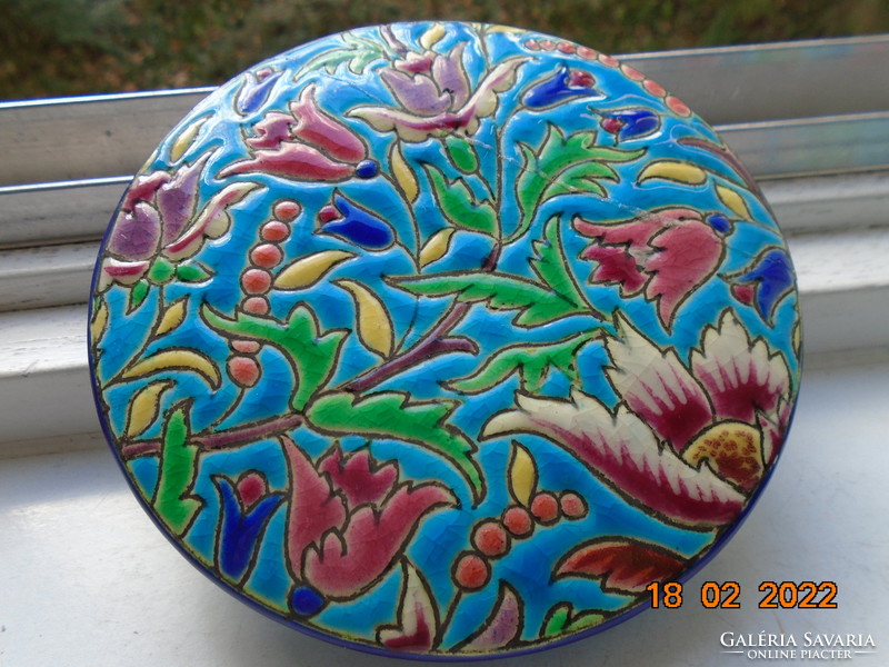 Antique longwy majolica bonbonier embossed with colorful enamel patterns on a turquoise background