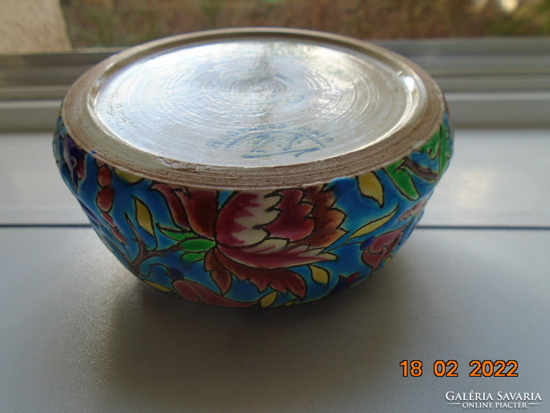 Antique longwy majolica bonbonier embossed with colorful enamel patterns on a turquoise background