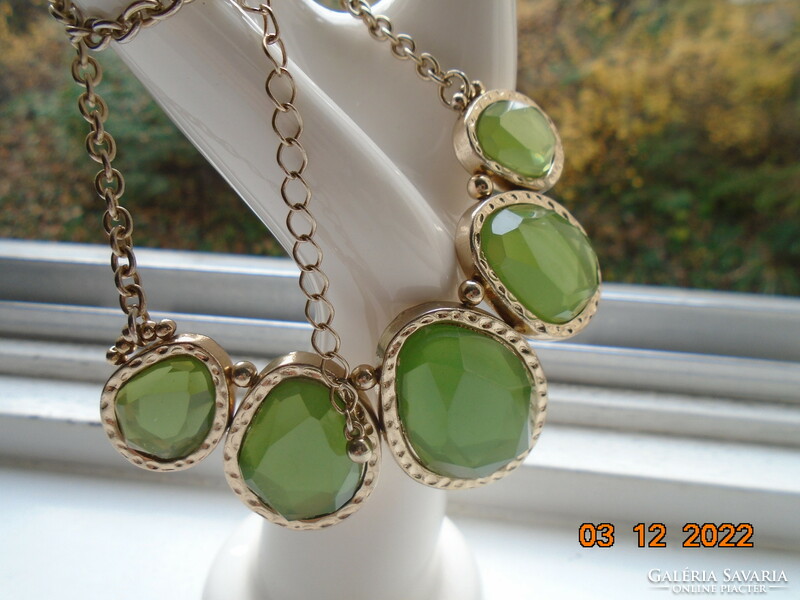 Necklace made of 5 large flat-faced interlocking lime green glass pendants in a silver-plated socket, with a chain