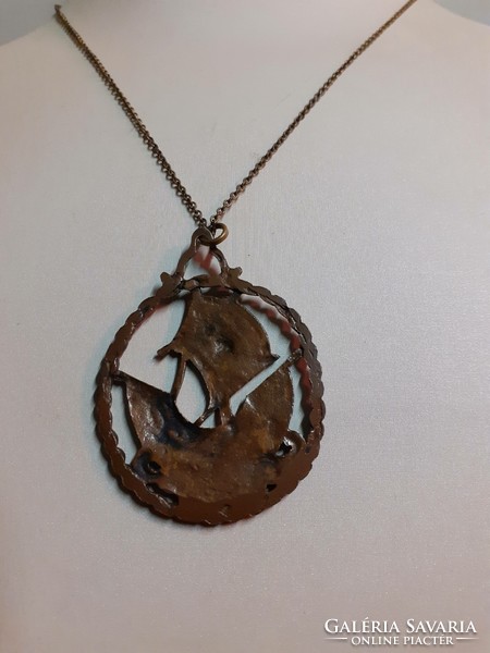 Retro bronze industrial art long necklace with a scene pendant with an openwork pattern on it