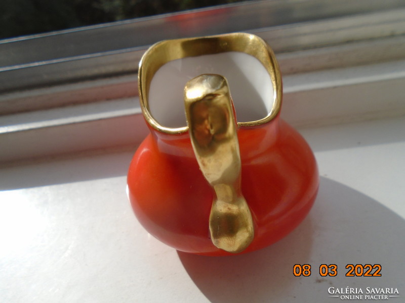 Antique pirkenhammer with decorative orange bay gilded milk spout