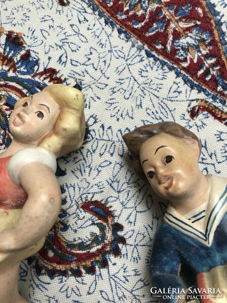 Pair of ceramic figurines dancing girl and boy playing the accordion