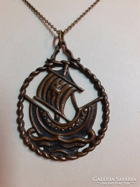 Retro bronze industrial art long necklace with a scene pendant with an openwork pattern on it