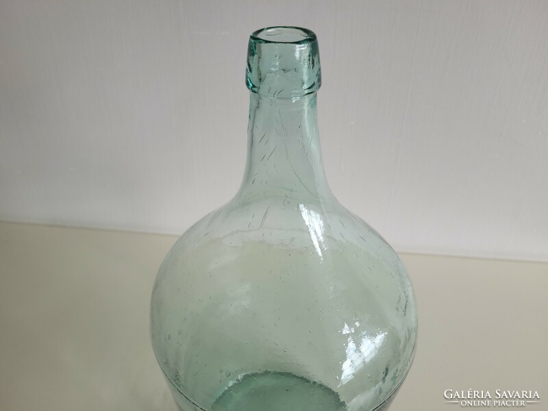 Old large size 5 liter turquoise green huta glass bottle with conical bottom balloon bottle