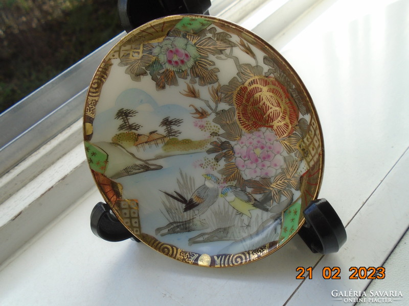 Antique hand-painted, gold-contoured eggshell porcelain Japanese bowl with a pair of birds and a flower pattern
