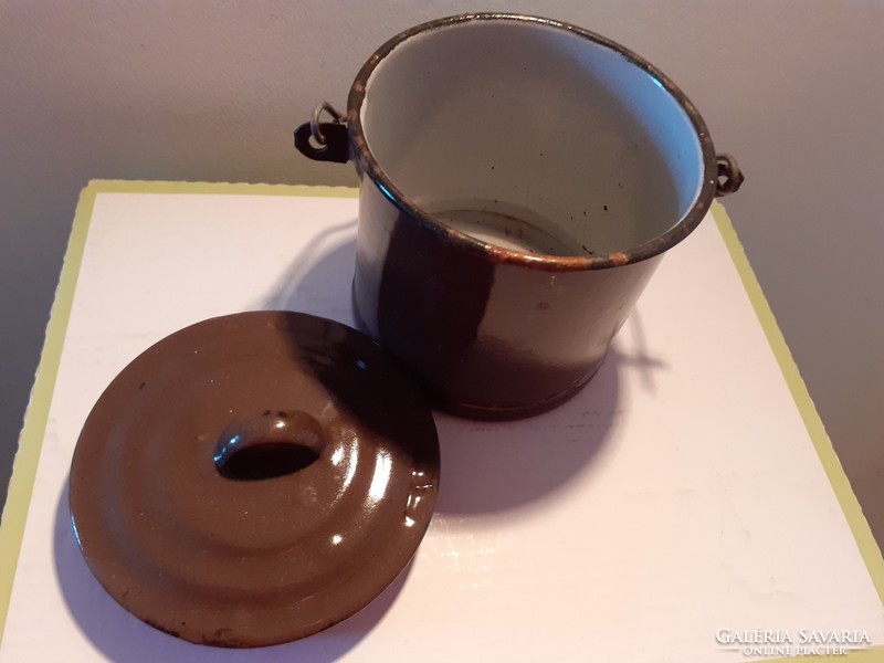Old enamel barrel with vintage enamel lid brown food