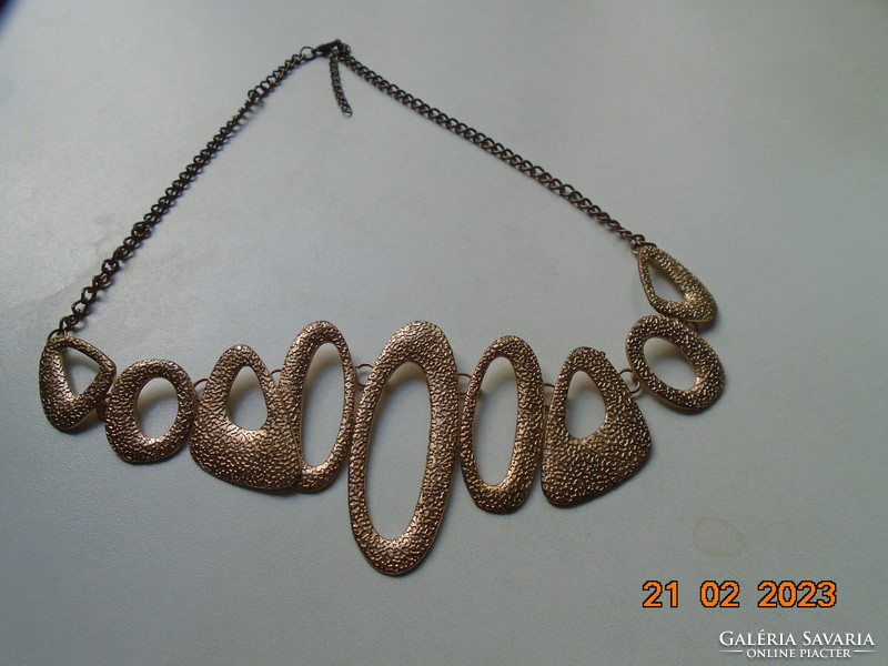 Handmade vintage necklace of 9 asymmetric oval textured elements with gold effect