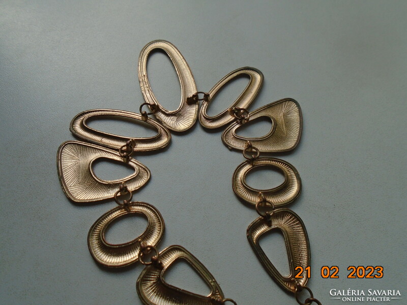 Handmade vintage necklace of 9 asymmetric oval textured elements with gold effect