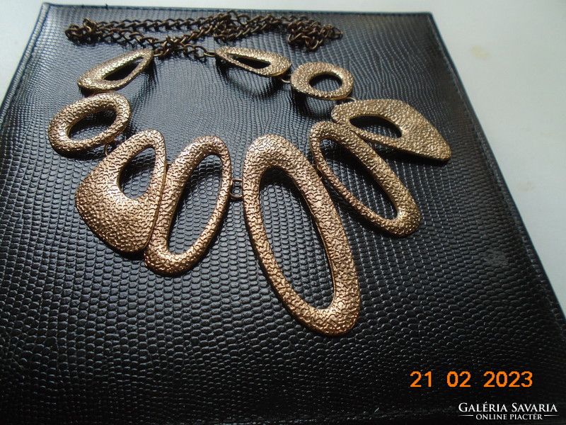 Handmade vintage necklace of 9 asymmetric oval textured elements with gold effect