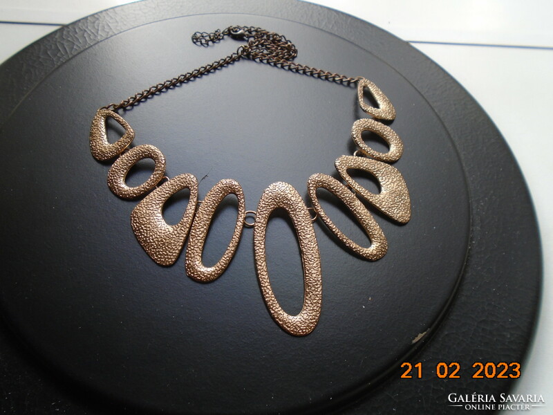 Handmade vintage necklace of 9 asymmetric oval textured elements with gold effect