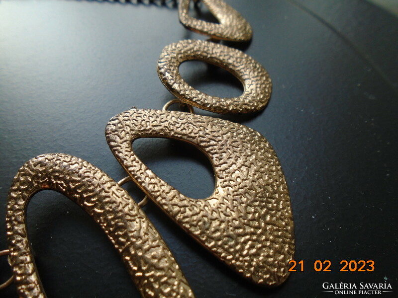 Handmade vintage necklace of 9 asymmetric oval textured elements with gold effect