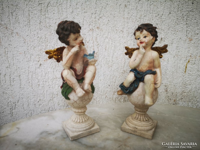 Winged painted colorful angels with angels, singly or in pairs