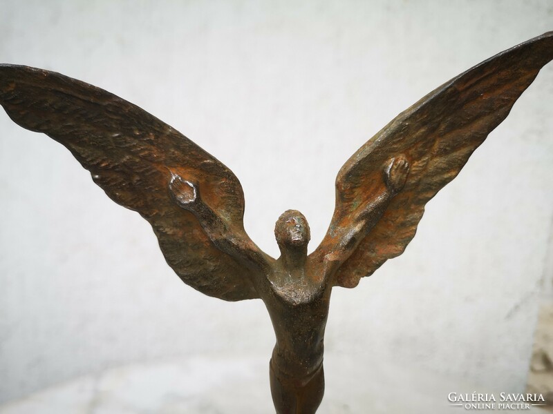 Special art deco secession style Icarus statue made of metal. (Naked flying man) on a vinyl base