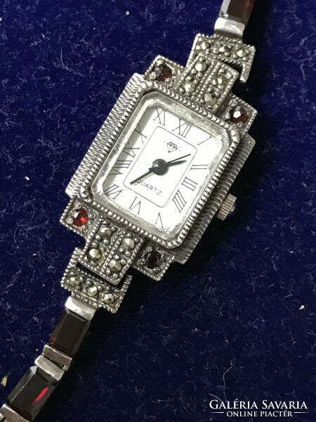 Art deco style silver bracelet watch decorated with garnet stones and marcasite marked 925.