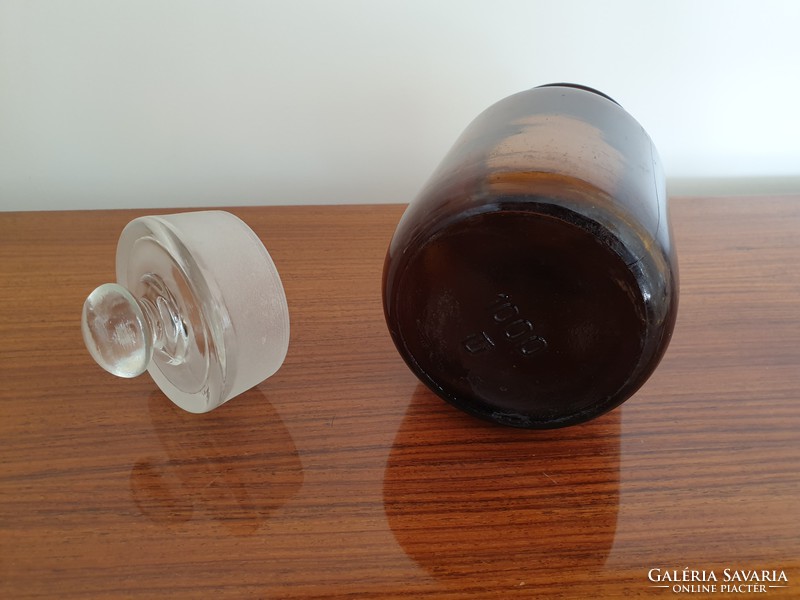 Old vintage pharmacy glass jar with conical stopper in brown pharmacy bottle