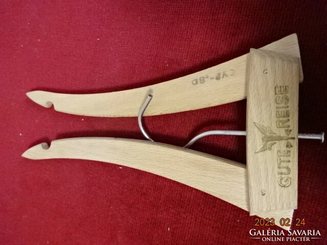 Folding, traveling wooden hanger, length 43 cm. Inscribed Gute reise. Jokai.