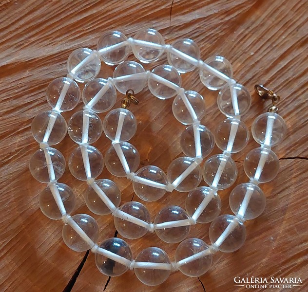 A beautiful big-eyed rock crystal necklace with knotted lacing