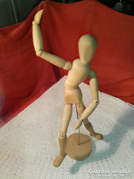 A wooden man, everything is movable, an illustrative and educational piece.