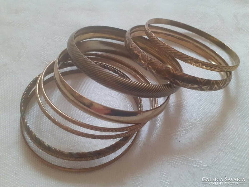 Copper-colored bracelets together (8 pcs.)