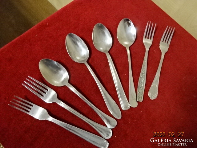Chrome cutlery, four spoons, four forks, all different. Jokai.