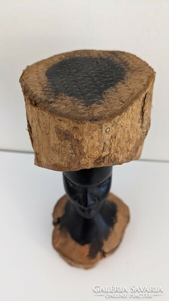 Carved wooden head sculpture from South Africa in black ebony surrounded by another type of wood