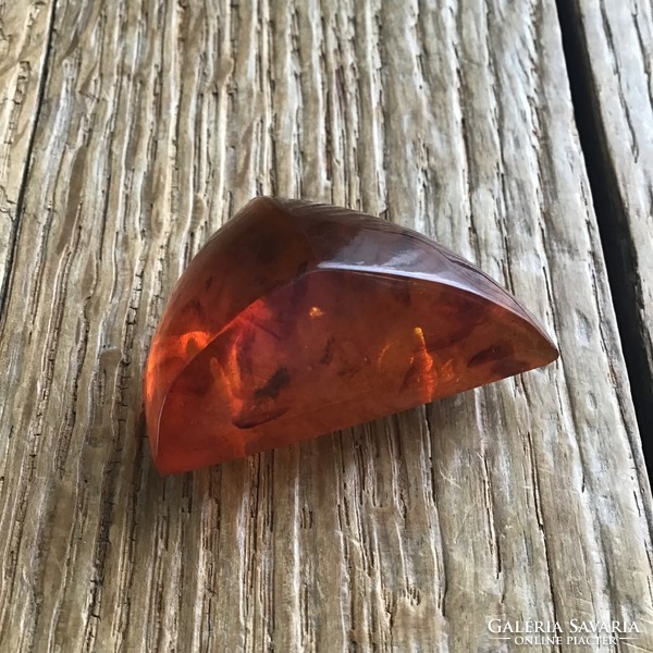 Old amber brooch with gilded mount