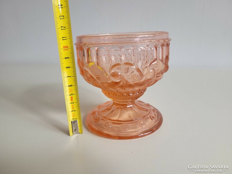Old glass goblet with pink base
