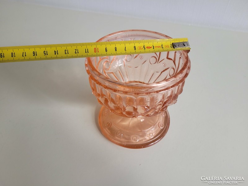 Old glass goblet with pink base