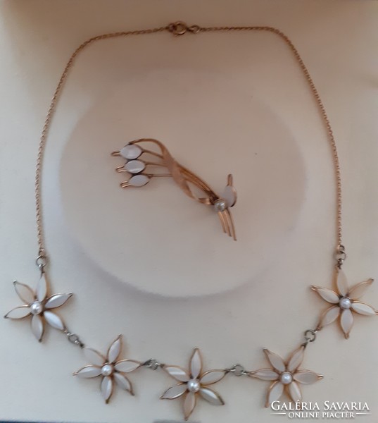 A beautiful old necklace made of real mother-of-pearl inlaid flowers with a matching brooch