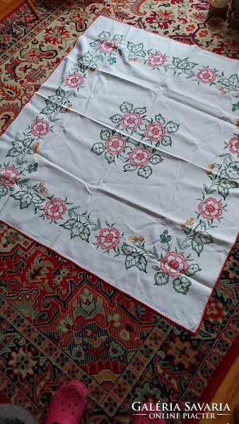 Old embroidered tablecloth with large folk flower patterns
