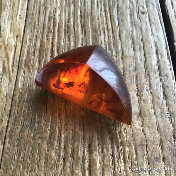 Old amber brooch with gilded mount