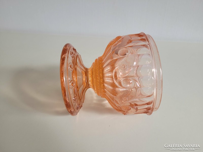 Old glass goblet with pink base