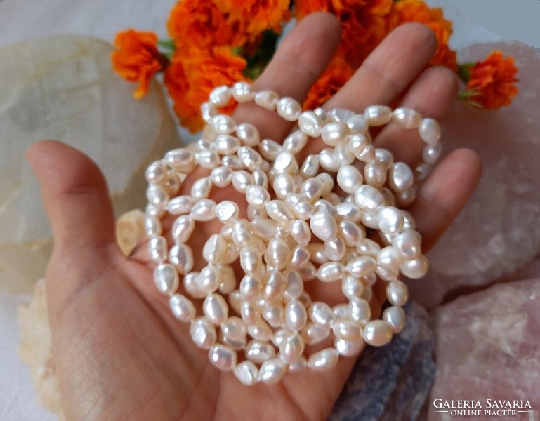 Real room. Extra long white freshwater pearl necklace made of selected beads, without clasp