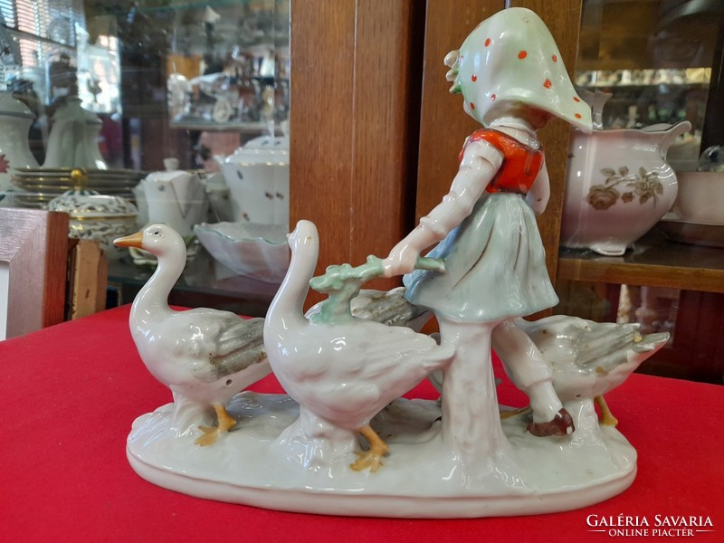 German, Germany Grafenthal, hand-painted porcelain figurine of a little girl herding geese.
