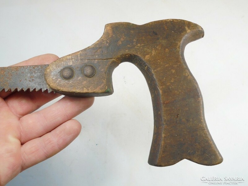 Antique old saw wood saw carpentry industrial tool from the early 1900s