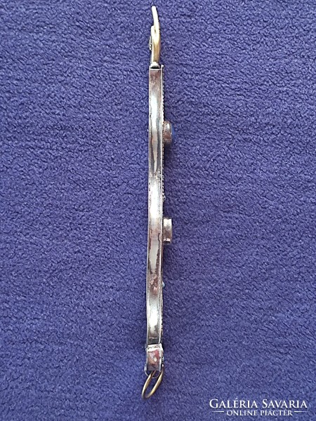 Antique silver Judaica pointing to the Torah