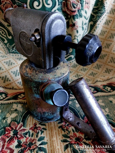 Bat soldering gas lamp with patina.