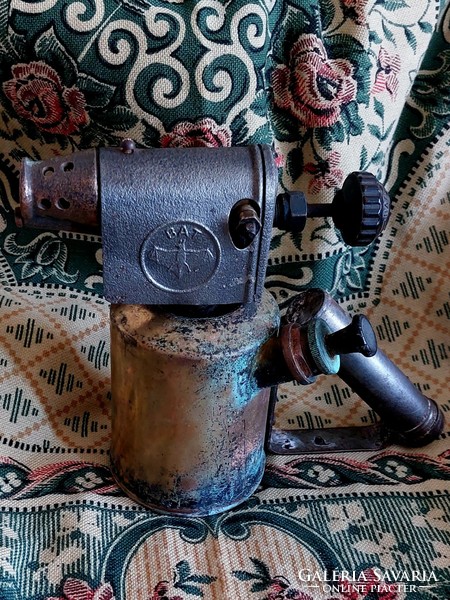 Bat soldering gas lamp with patina.