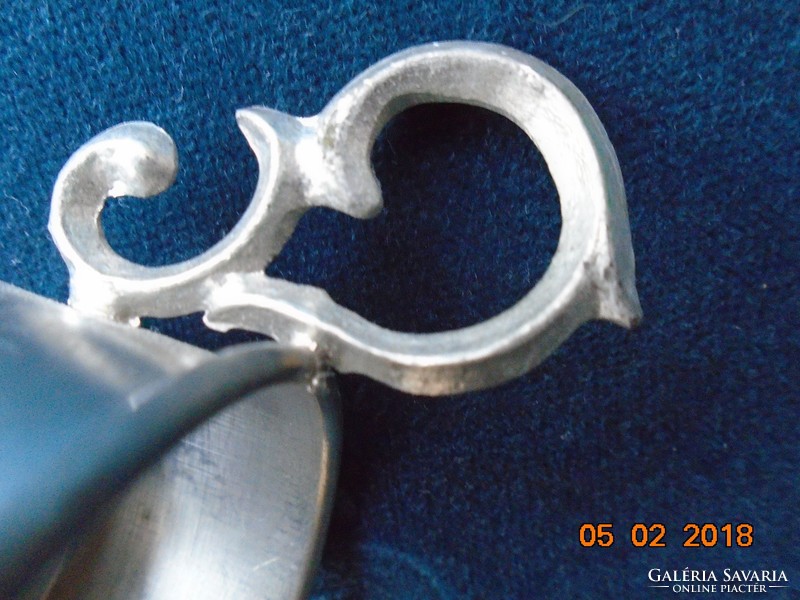 Pewter cup holder with decorative tongs with a chiseled floral pattern